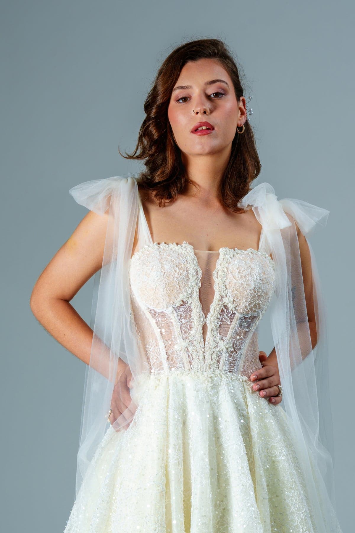 Inside the HH Maison atelier — a bridal gown being hand-finished with beadwork and appliqué