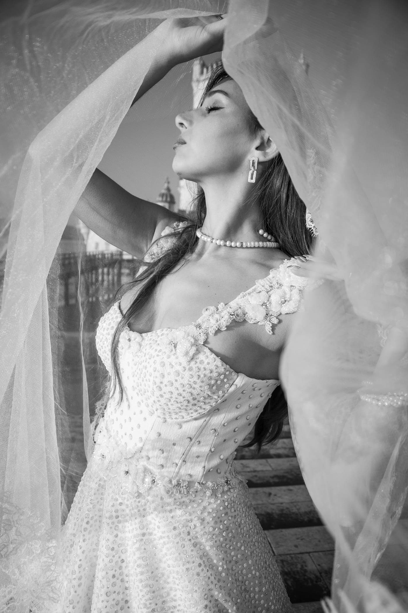 Bride turning, skirt sweeping the stone