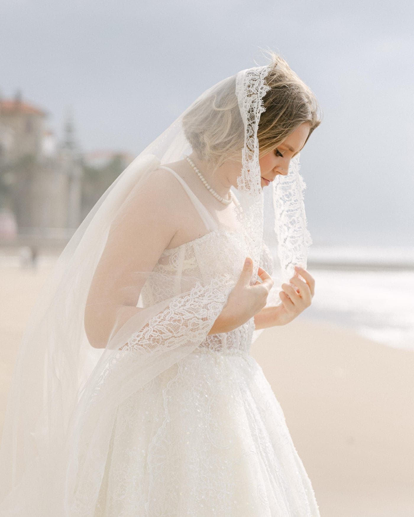 Wind catching the tulle at the shoreline