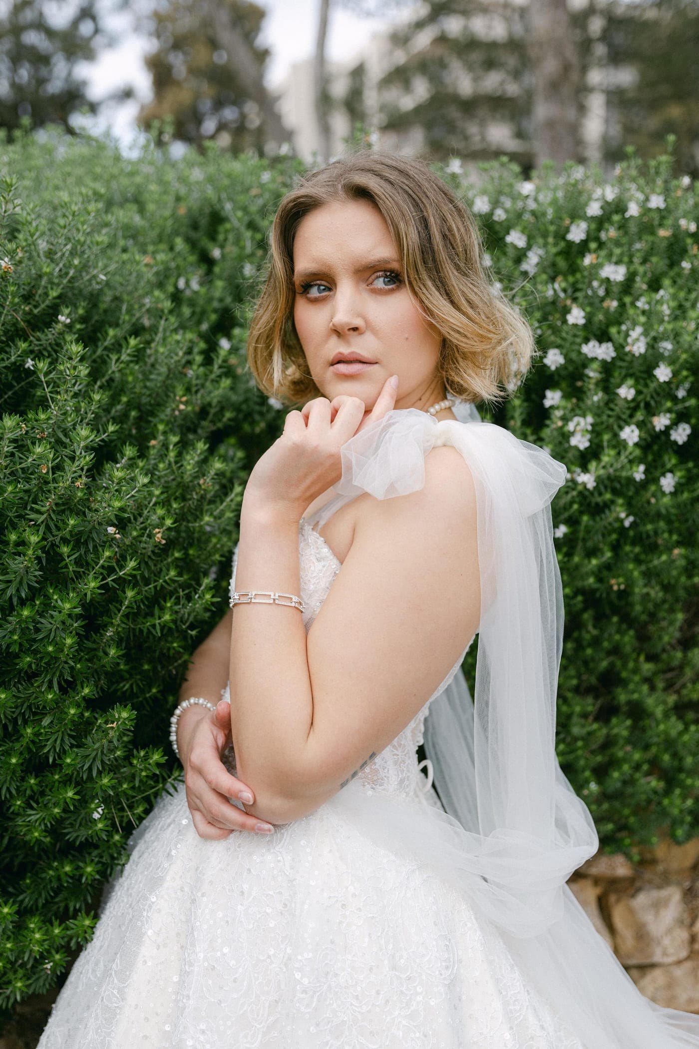 Lace cape and beaded bodice, close