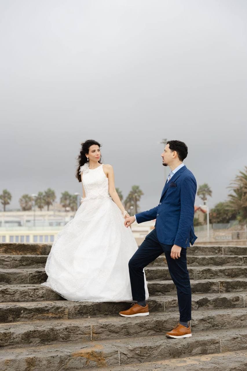 Couple on the steps above the sea