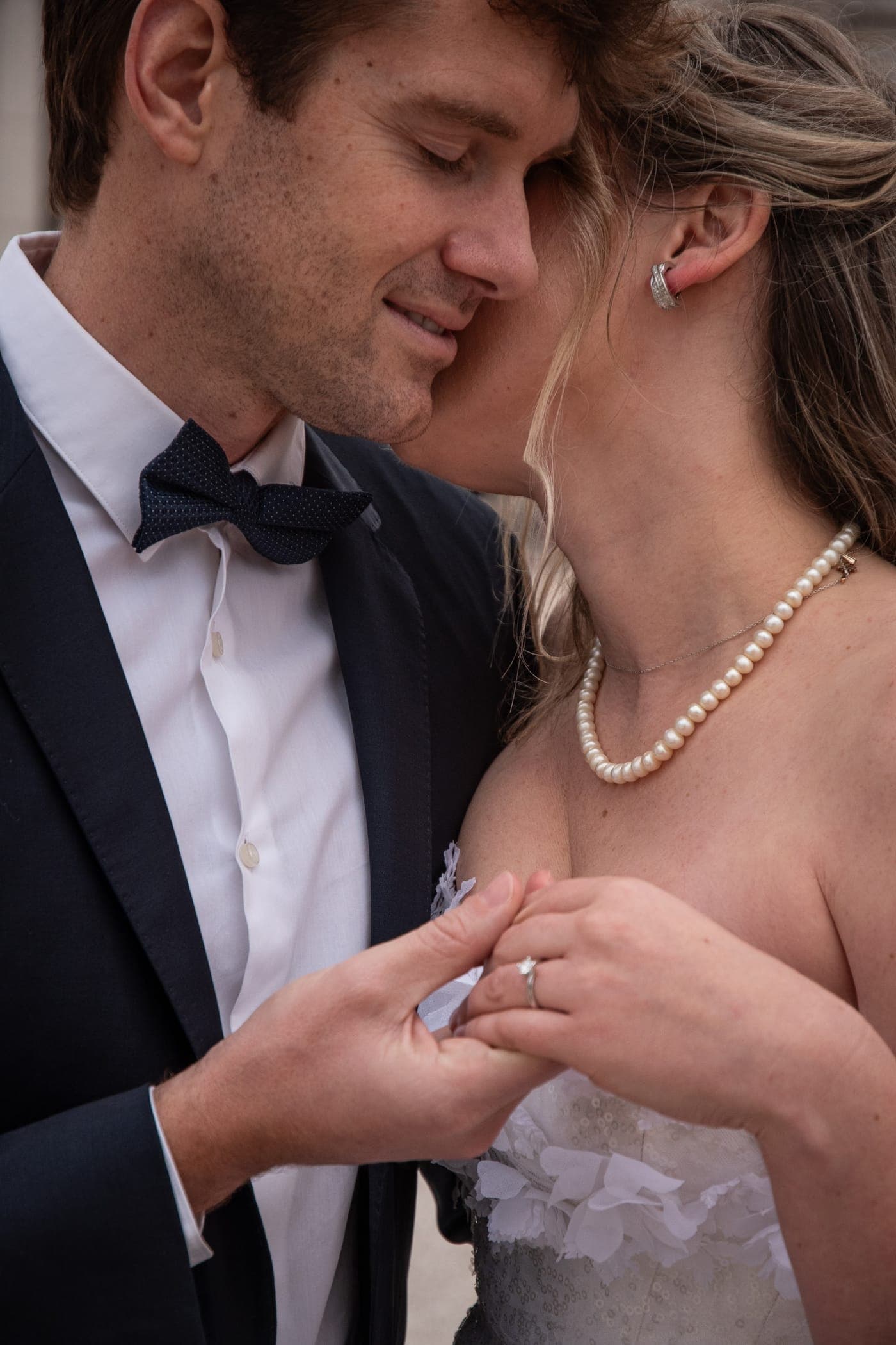 Close: her hands in his
