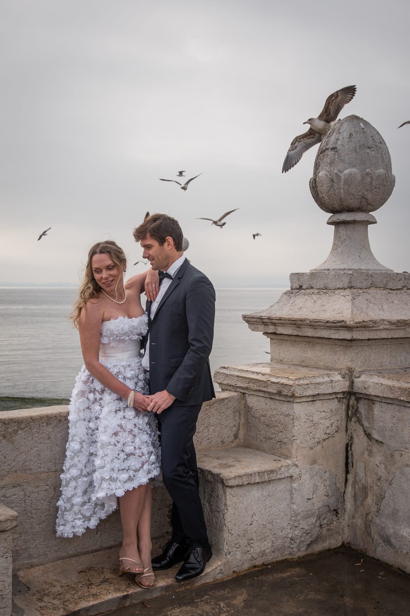 Gulls over the columns as they kiss