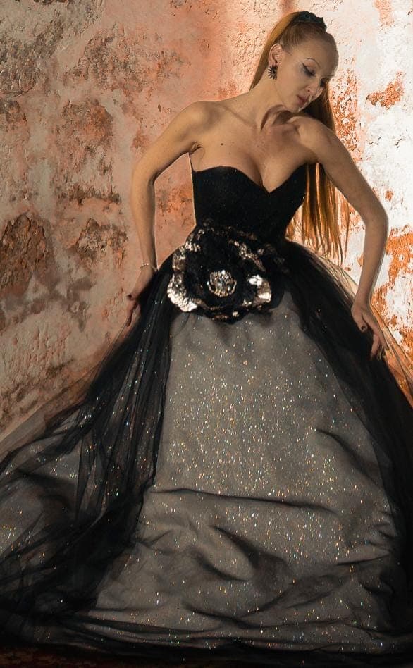 The finished gown, photographed against stone