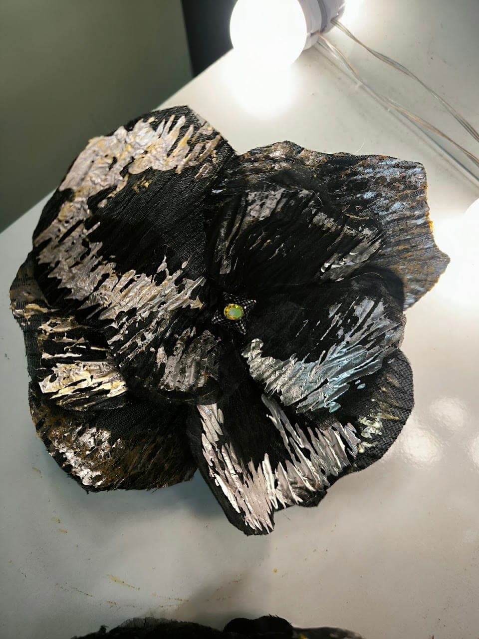 A single hand-made flower, complete