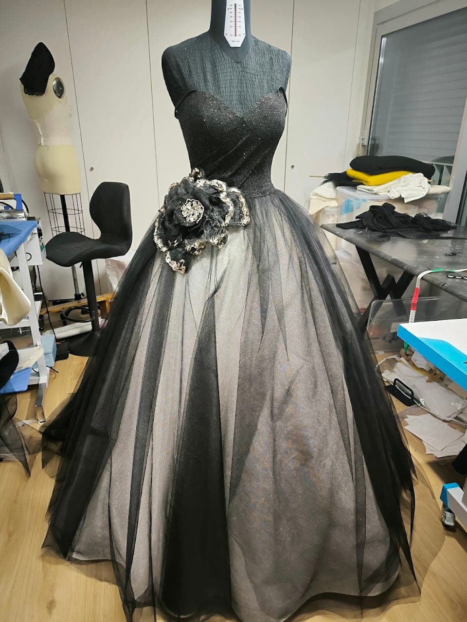 The gown on the stand, skirt full