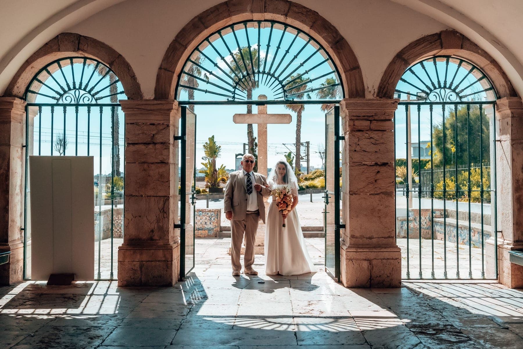 The couple framed in the church arcade