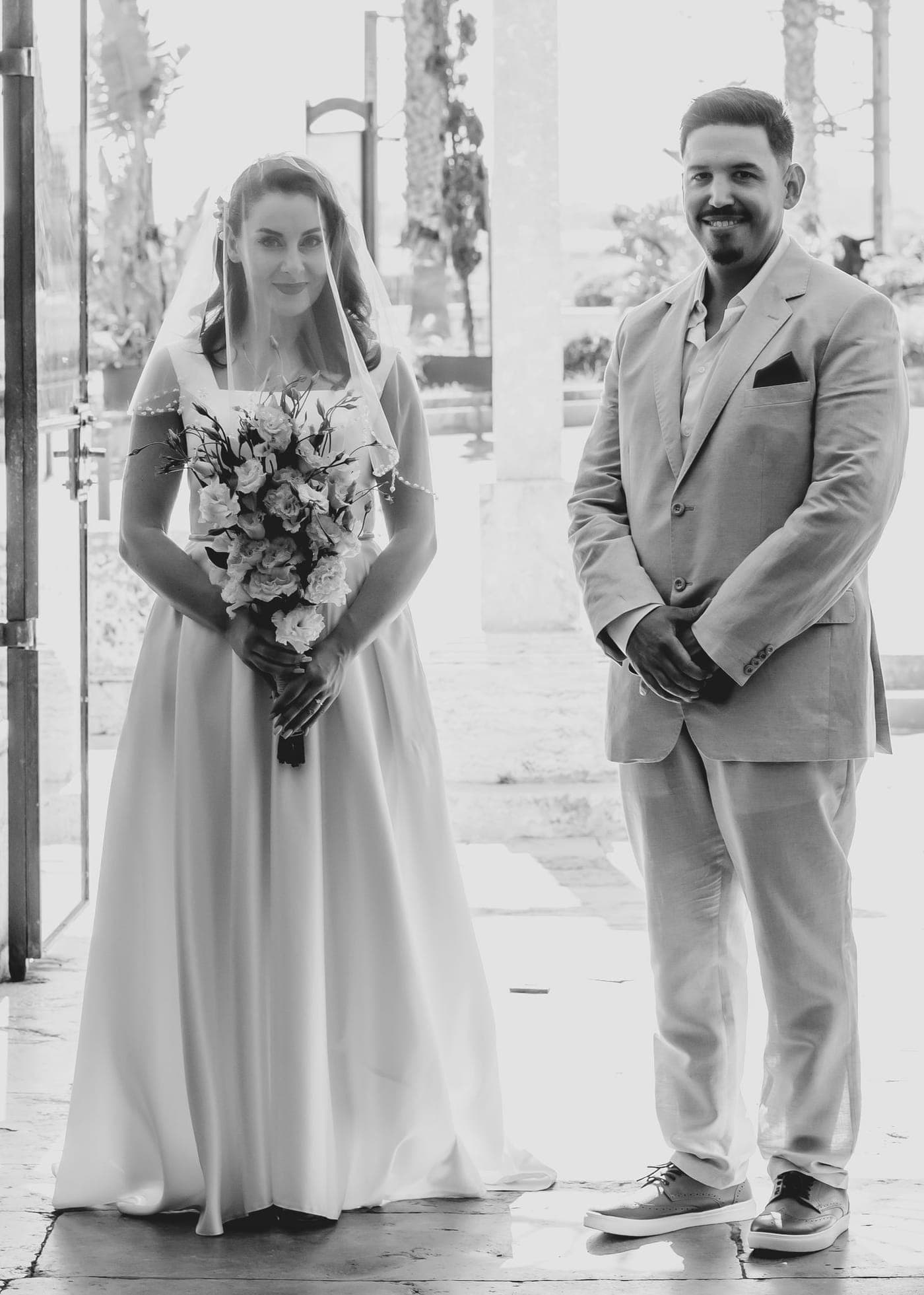 Portrait on the steps, bouquet in hand