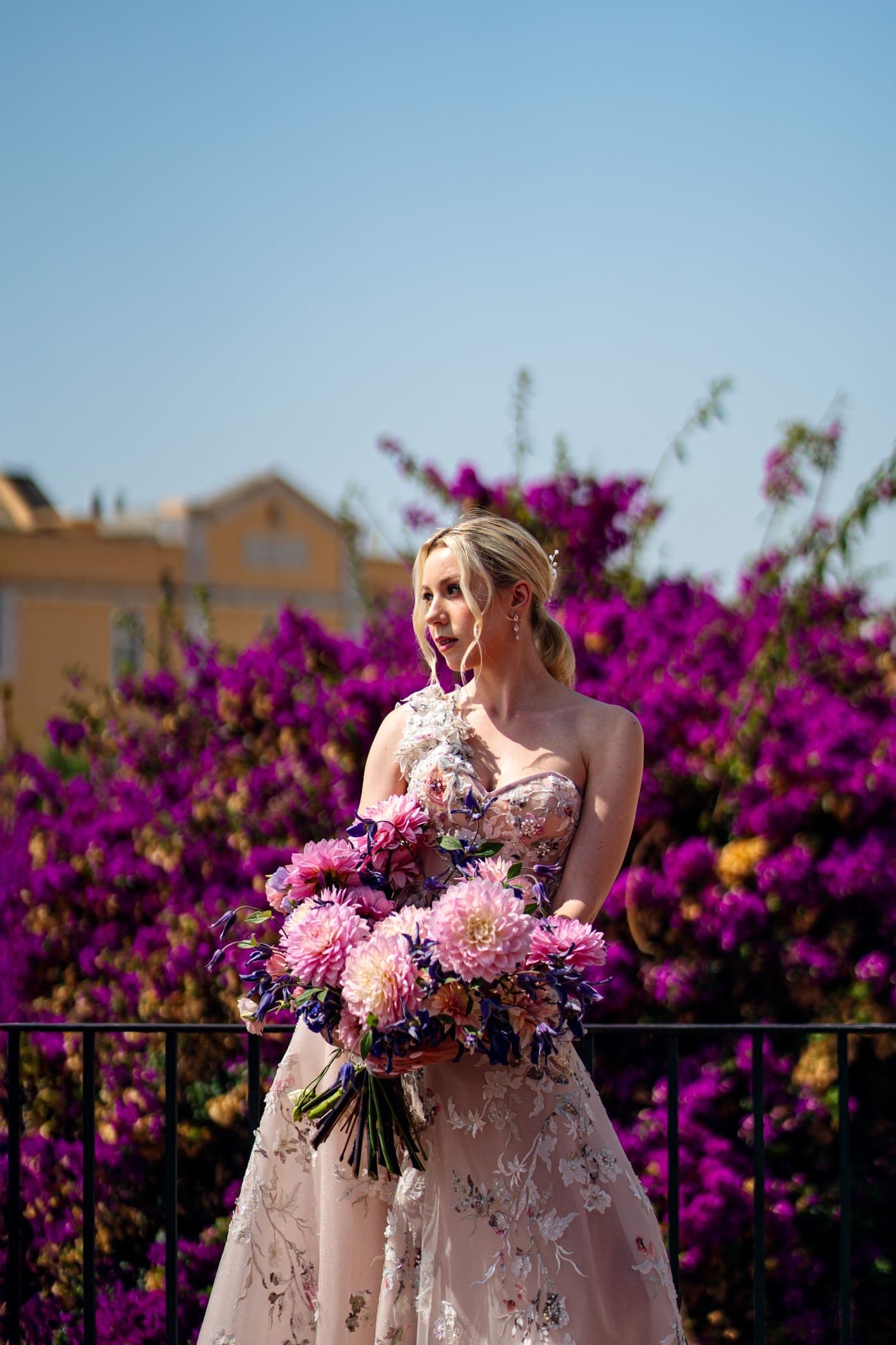 The blush of the dress against the magenta