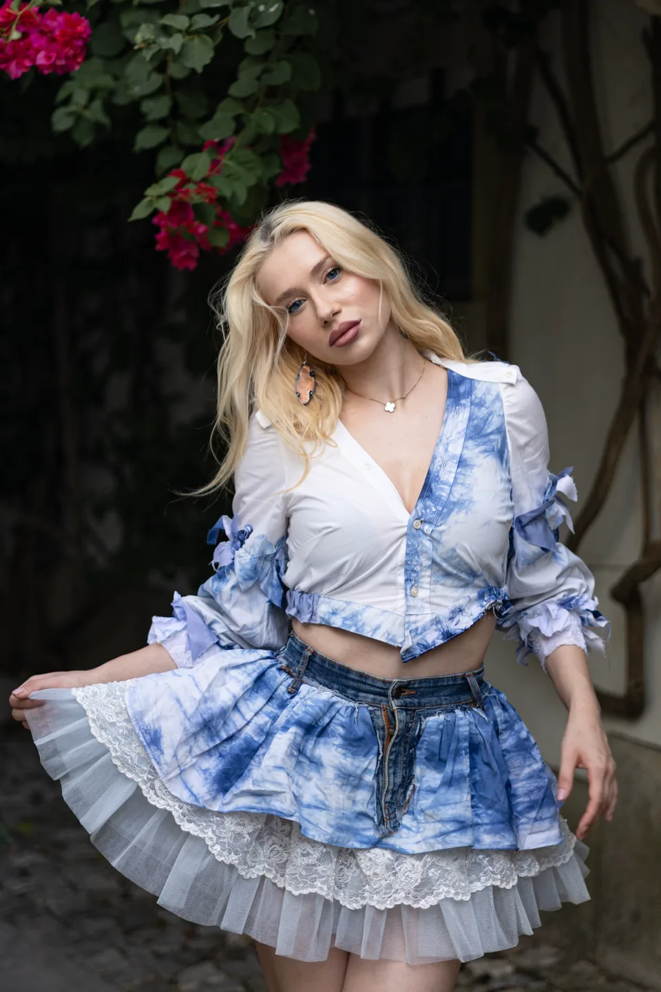 White shirt with ribbon sleeves over a tie-dye tiered mini skirt
