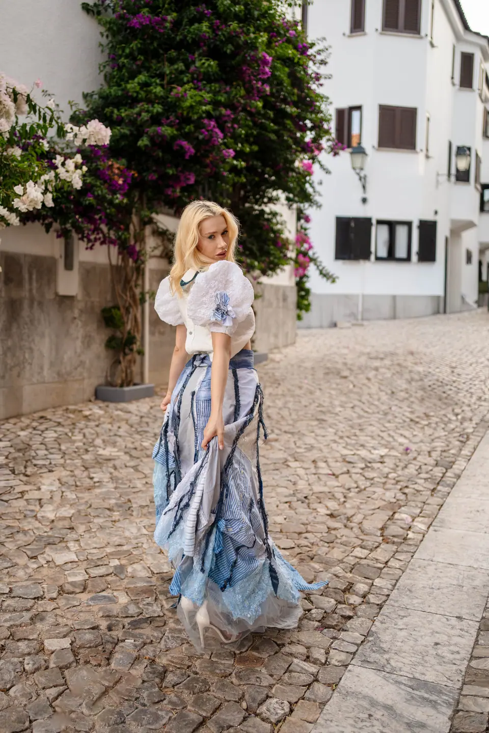 Navy corded lace off-shoulder blouse with white lace flares